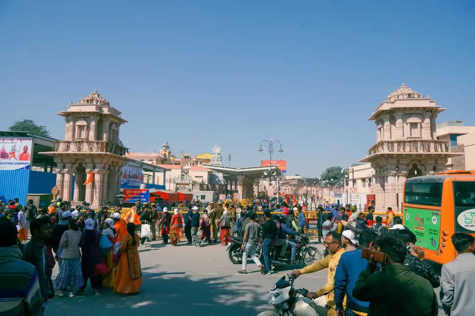 Pilgrims and crowds at Ayodhya Dham entrance gates near Ram Mandir
