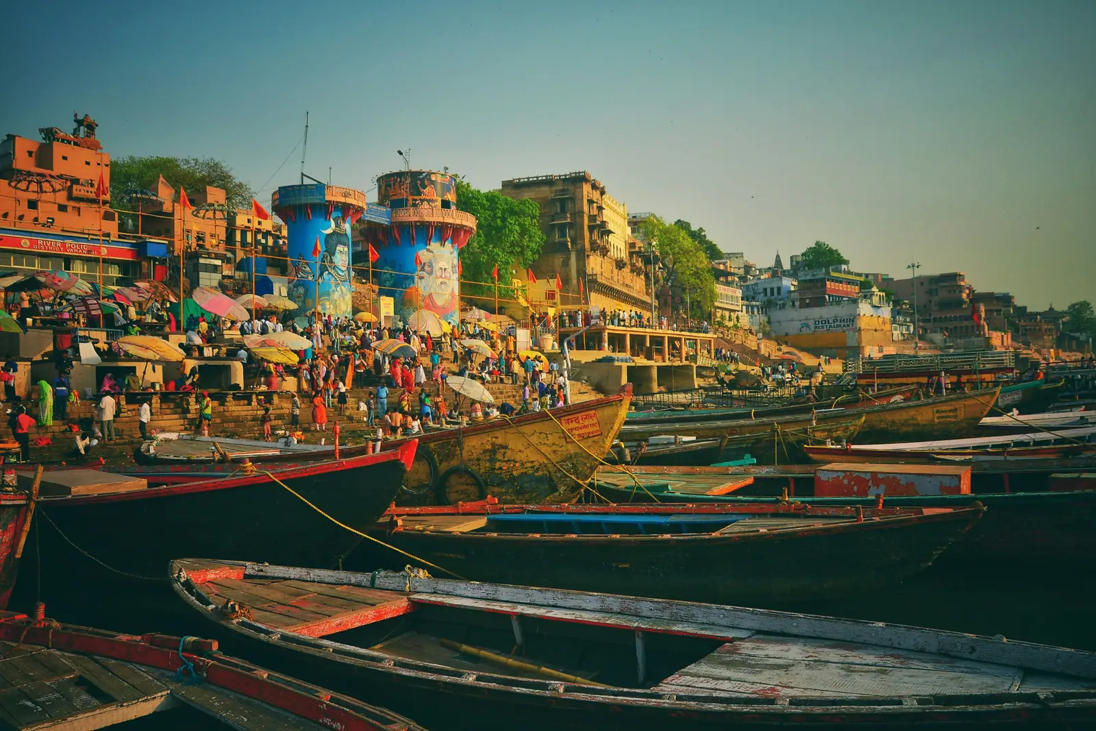 Pilgrims and boats at the Varanasi ghats in the evening light
