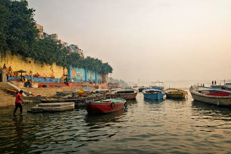 Boats on a misty, high Ganga at Varanasi during the monsoon